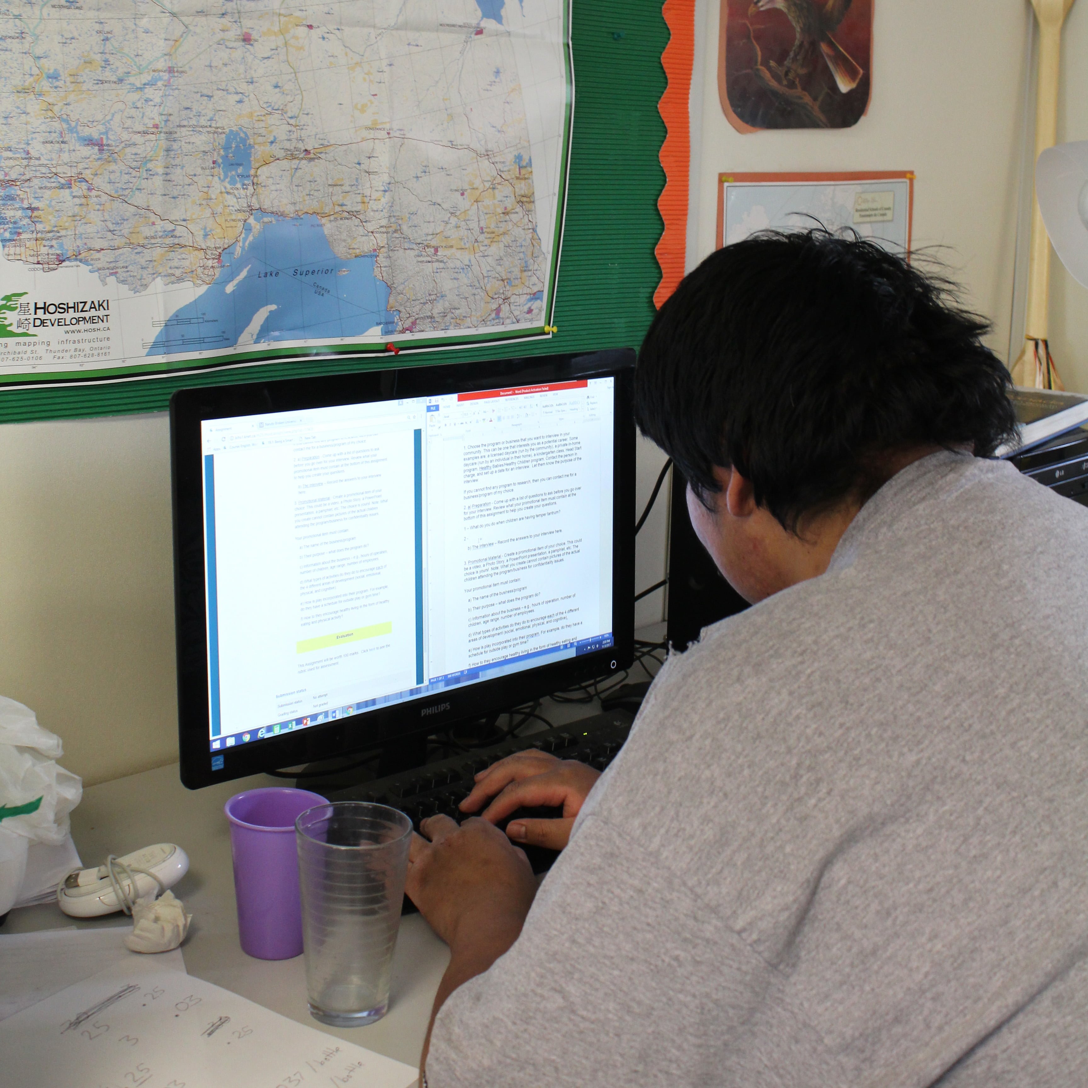 High school student working on a computer in Keewaywin First Nation